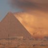 An image of ta sandstorm behind the Great Pyramid of Giza. Shutterstock.