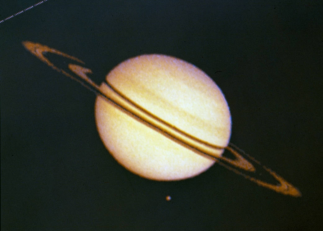 A photo of Saturn and Titan by Pioneer 11