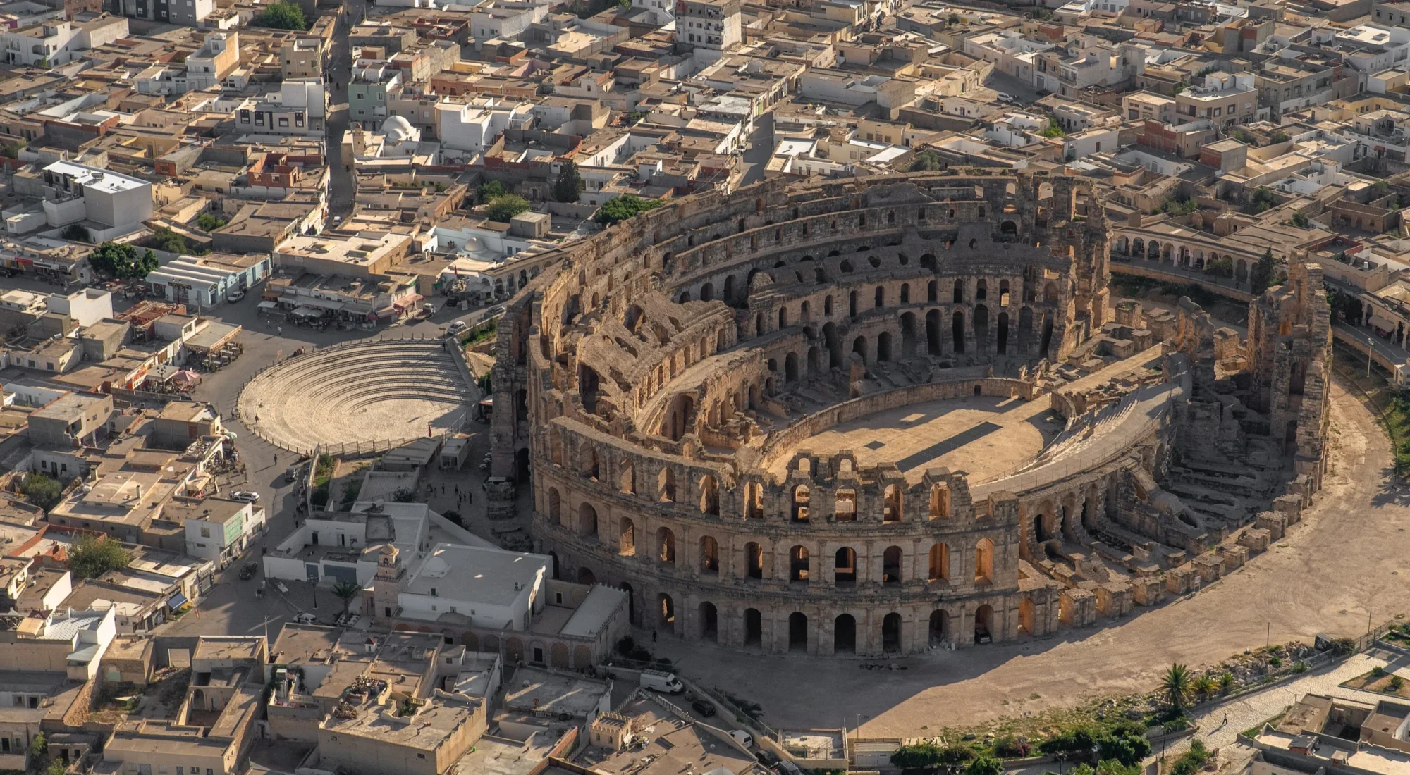 Aerial view of the Roman amphitheatre of El Djem surrounded by the modern Tunisian town