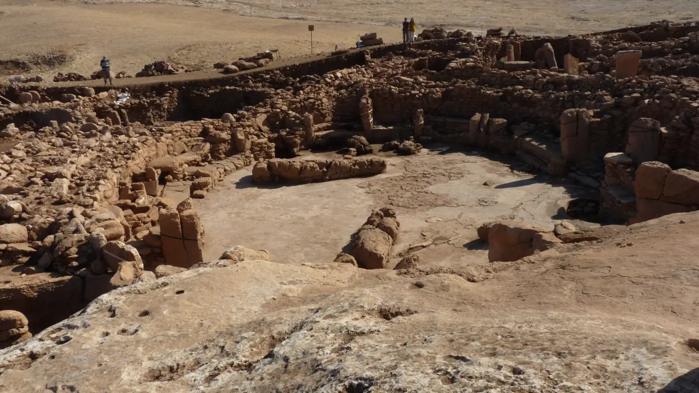 Excavated circular enclosure with upright stone pillars at Karahan Tepe in southeastern Turkey.